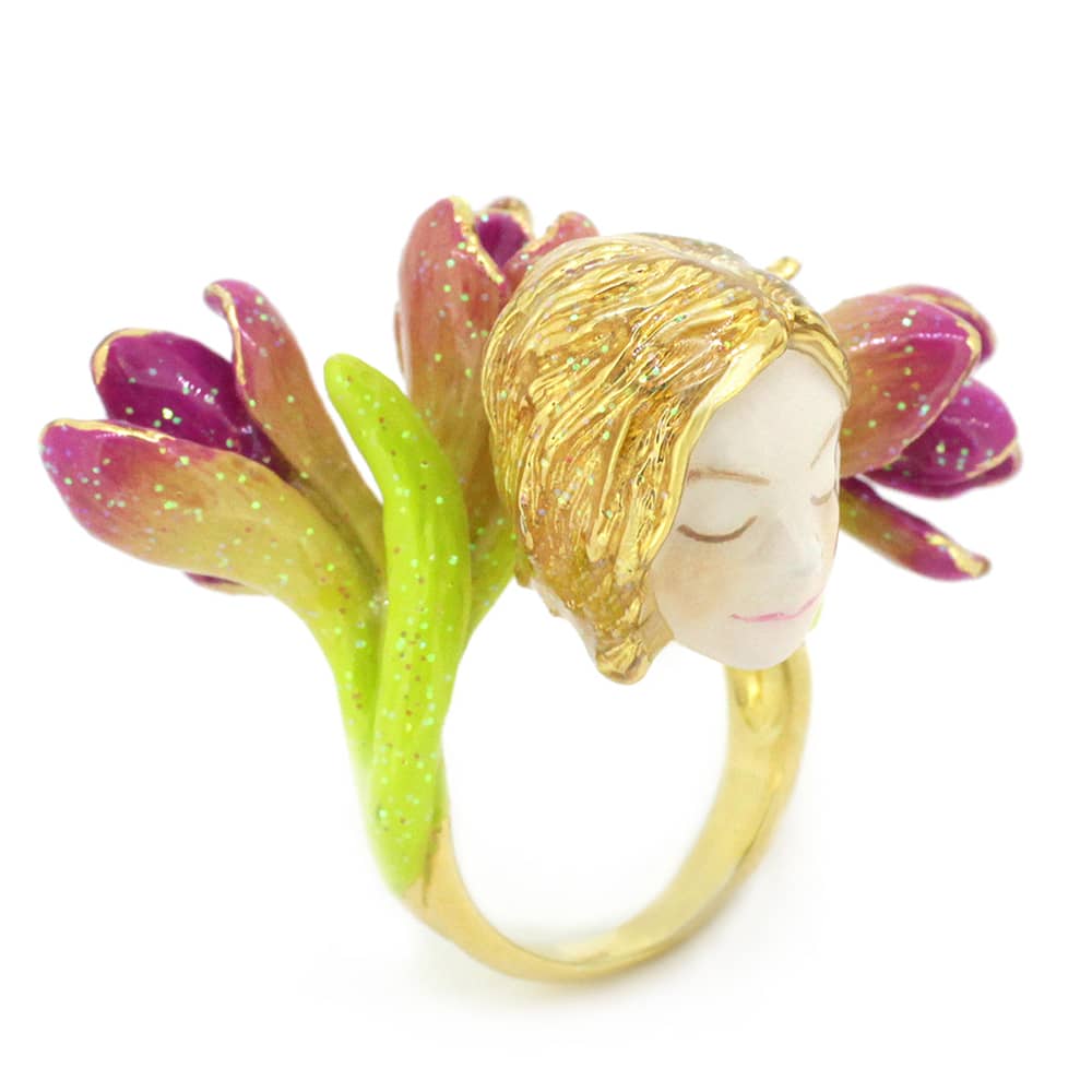 Fantasy-inspired ring featuring a nymph's face surrounded by pink and green flowers