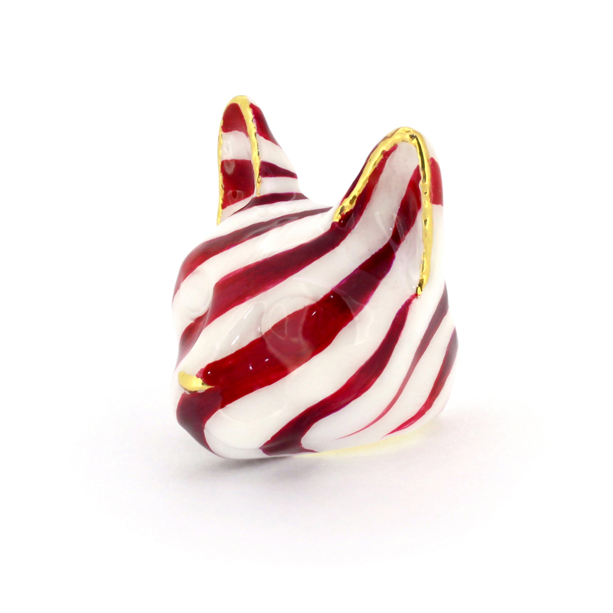 A unique cat ring showcasing a festive red and white stripe design inspired by candy canes.