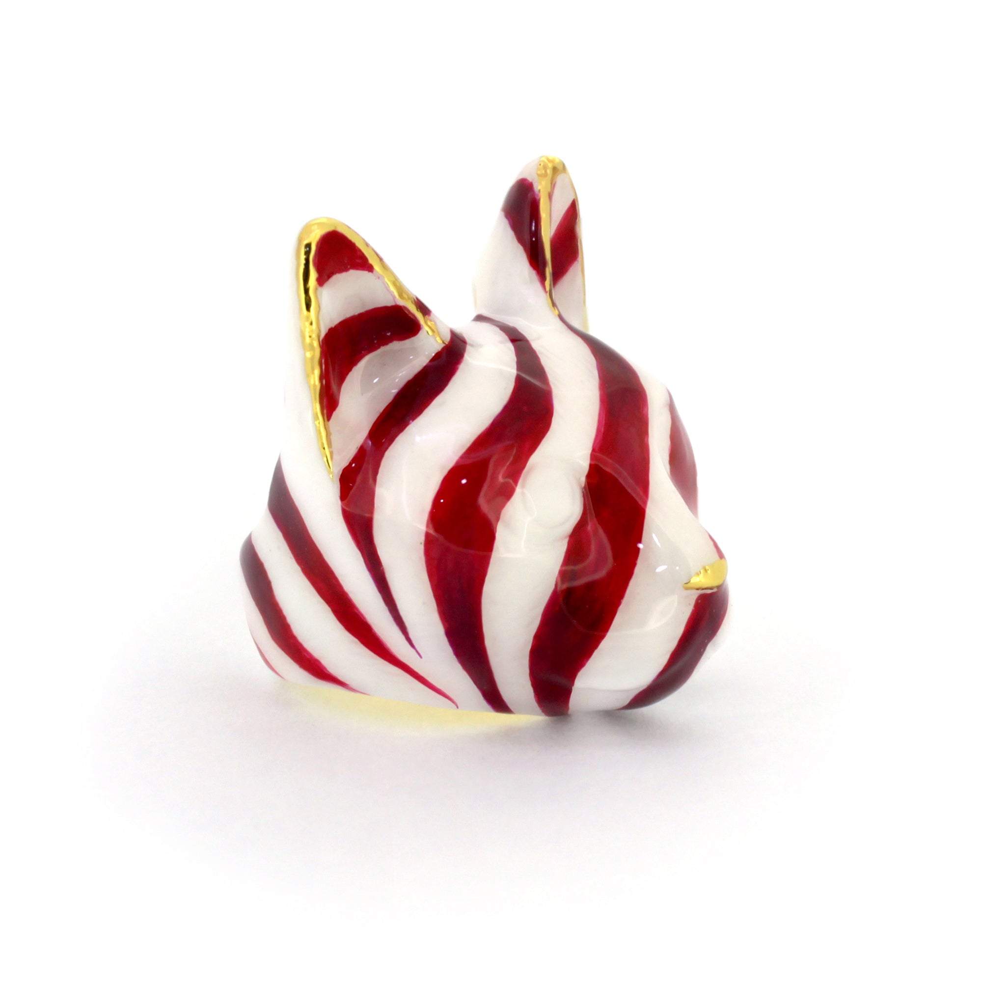 A unique cat ring showcasing a festive red and white stripe design inspired by candy canes.