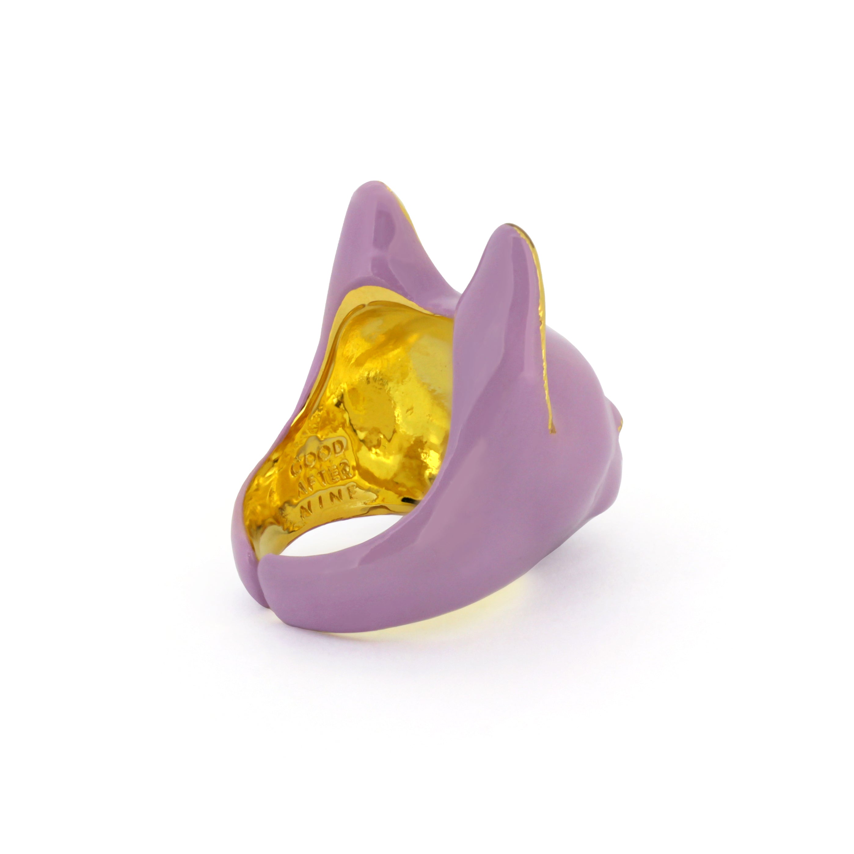 A whimsical ring designed in the shape of a cat’s head, featuring a soft lilac color.