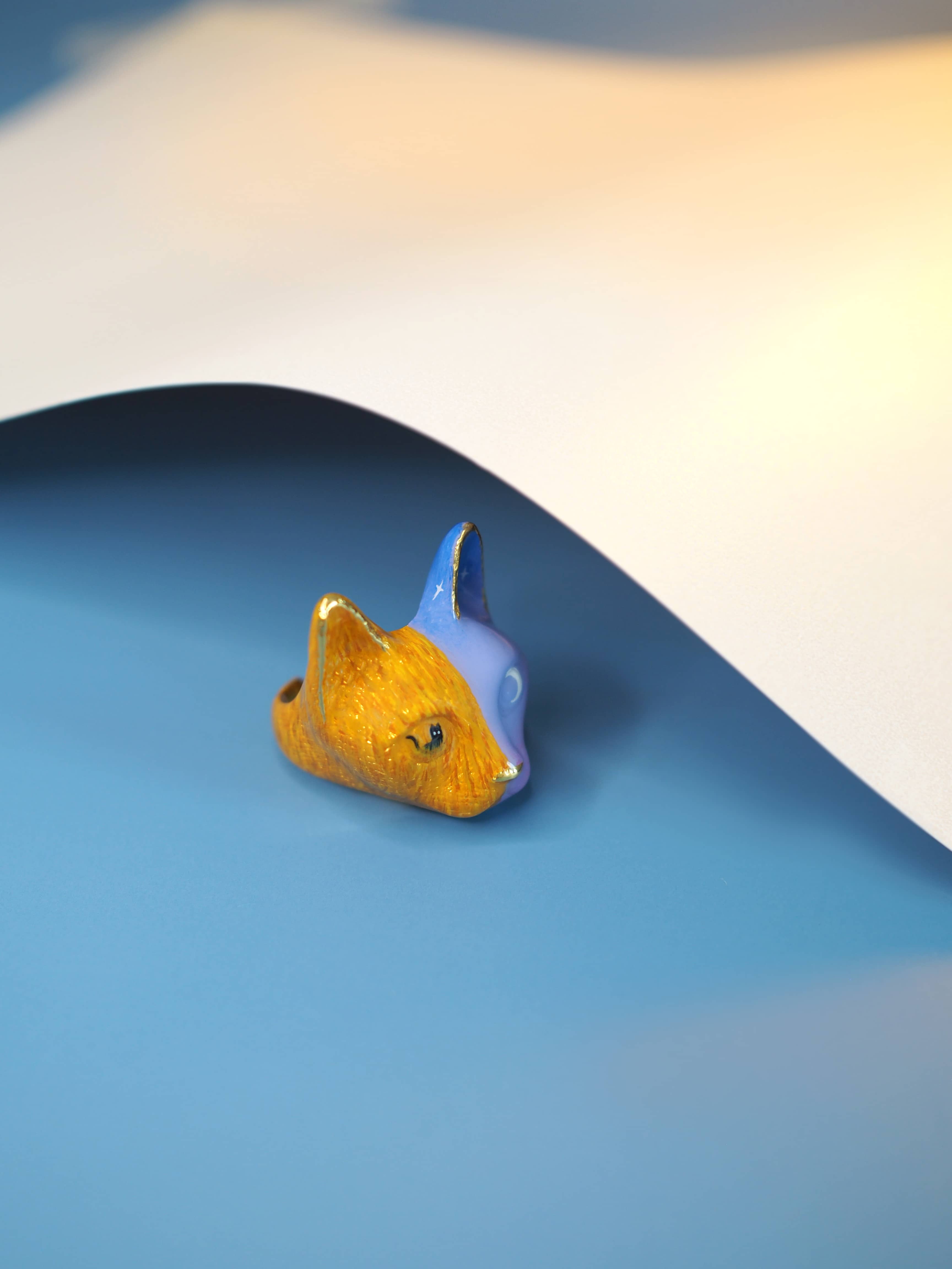 Unique hand-painted cat ring featuring vibrant colors, perfect for jewelry lovers.