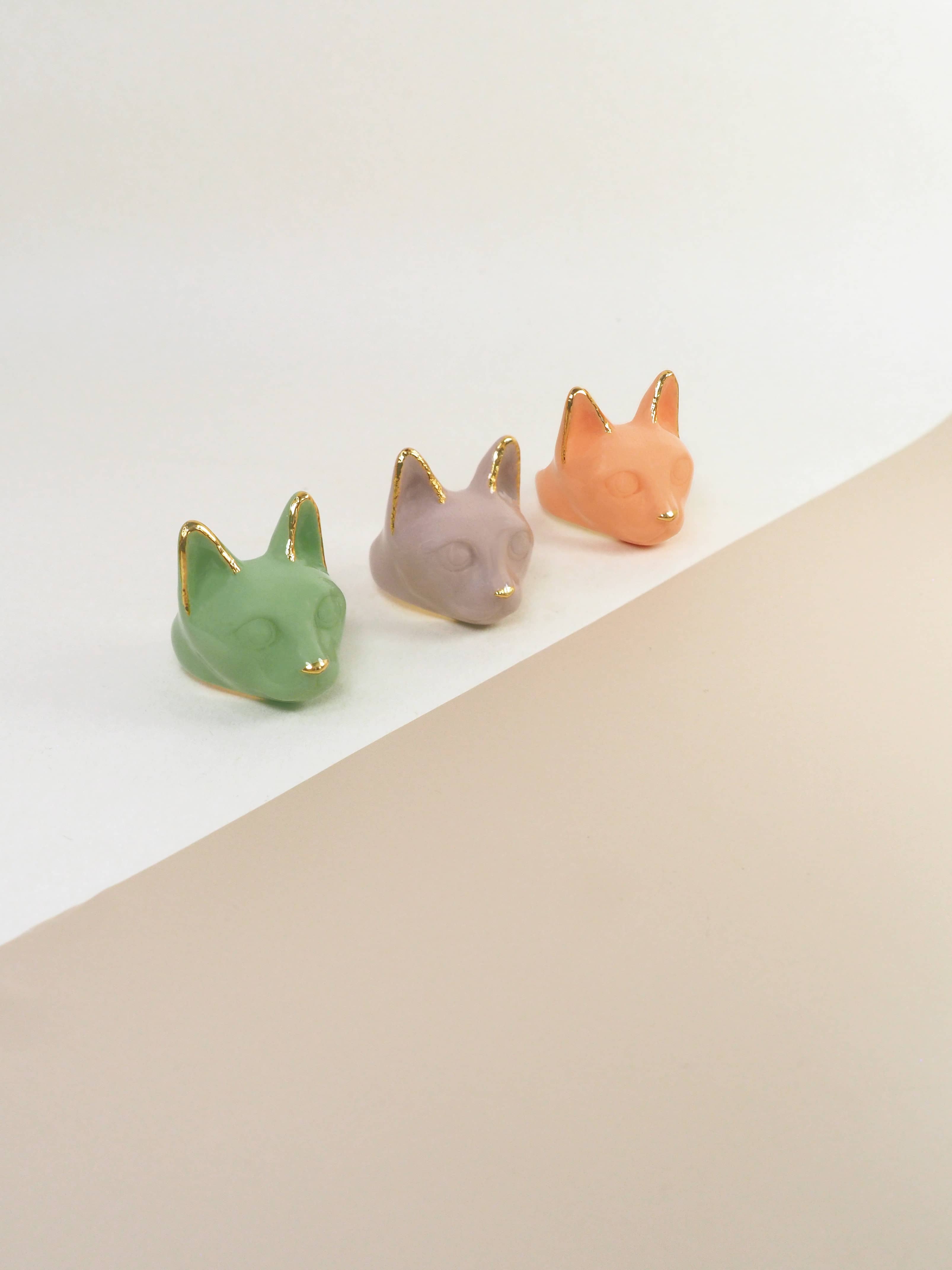 Set of colorful cat rings in green, dusty pink, and orange. Perfect for cat lovers and jewelry collectors.