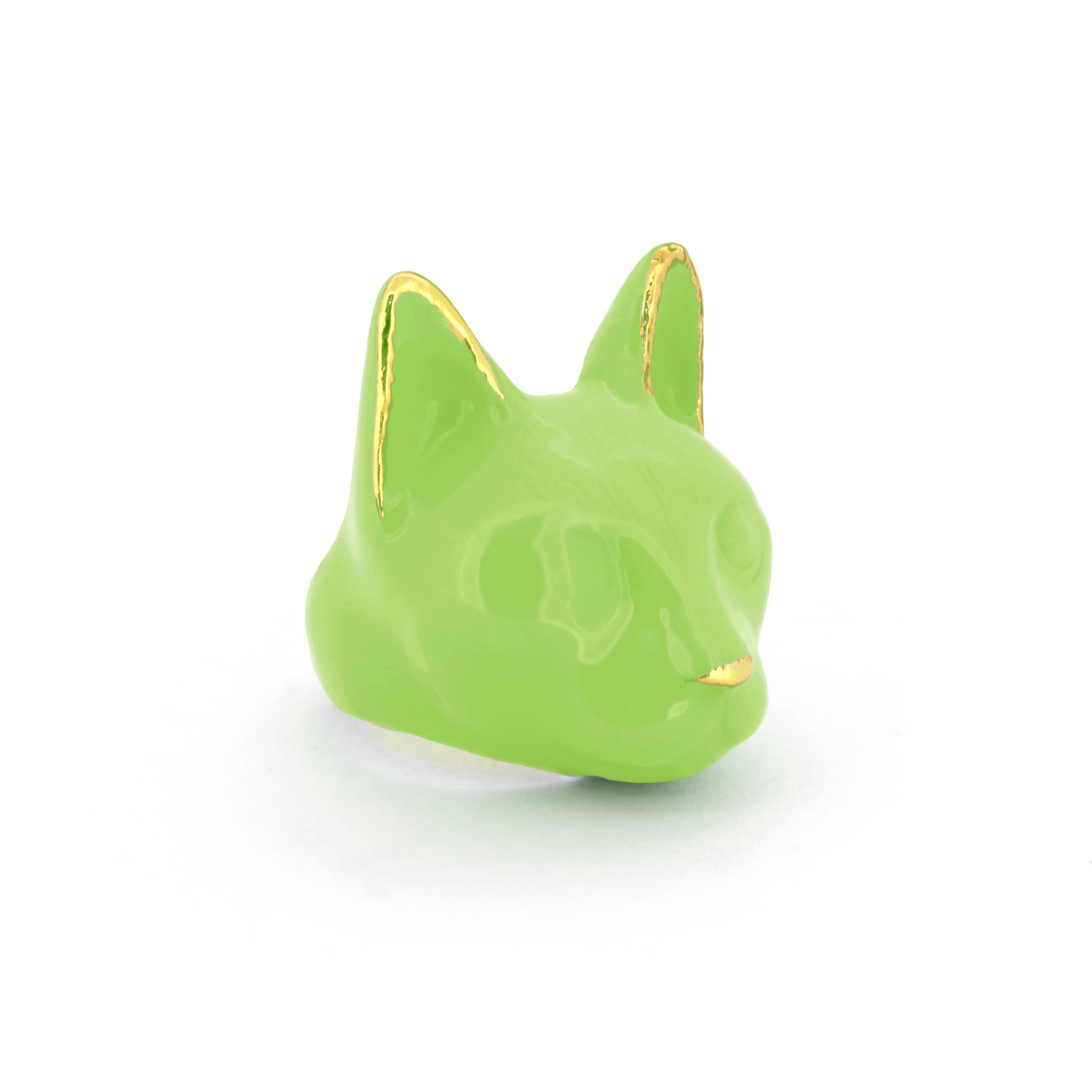 A vibrant green cat's head ring with gold accents on the ears and a small gold nose