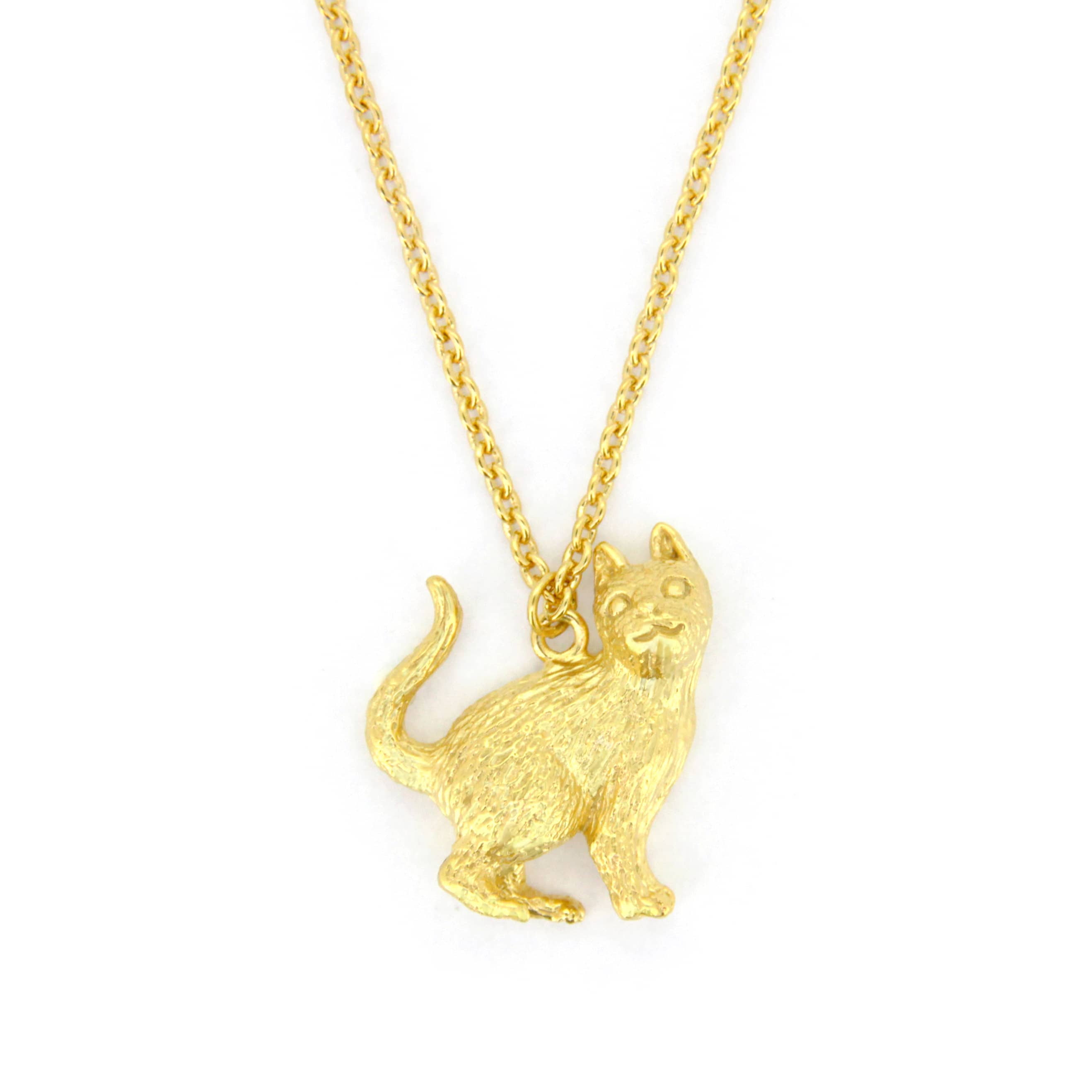 A whimsical gold pendant necklace featuring a standing up cat design, highlighting the fur's details and facial features.