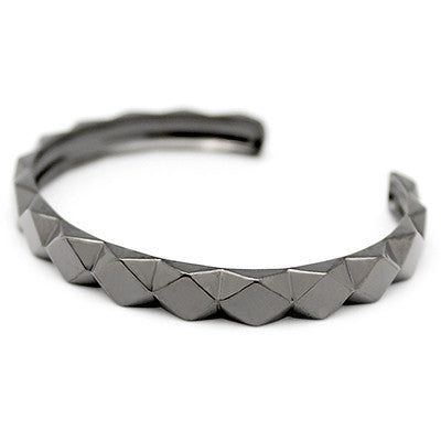 Modern bracelet featuring a chic geometric pattern.