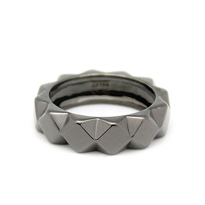 A unique edgy ring with a geometric design.