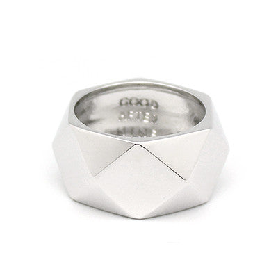 Minimalist silver ring with a faceted design, perfect for everyday wear.
