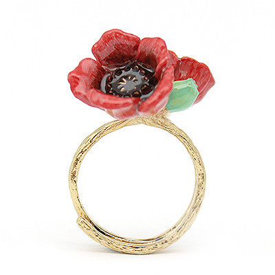 Beautiful flower ring featuring red poppies on a gold-toned band, perfect for flower lovers.