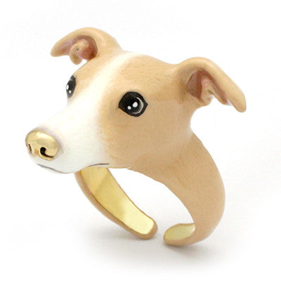 A dog's head ring featuring a light brown and white color scheme with black eyes and a gold nose, perfect for dog lovers.