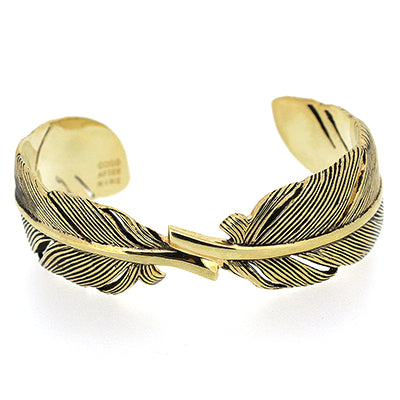 Elegant gold bracelet featuring intricate feather design