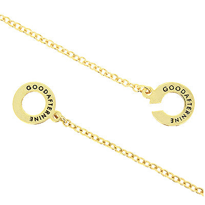 Golden necklace showcasing GoodAfterNine logo detail.