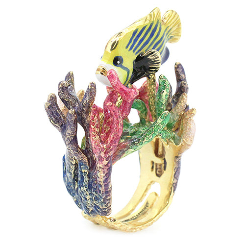 A beautiful handcrafted ring featuring a fish swimming among coral reefs.