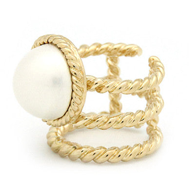 Unique gold ring with a braided rope design and a moon-like pearl.
