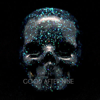 Black glitter skull ring with an enamel finish