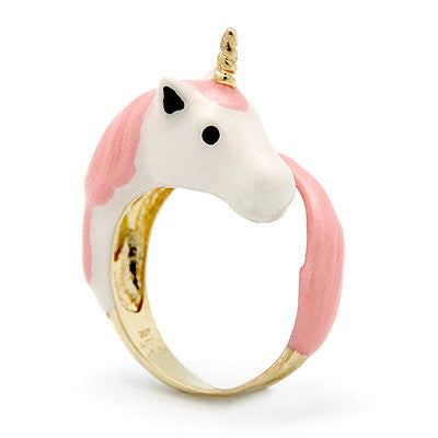 A fantasy-inspired unicorn ring featuring a pink and white design with a golden band.