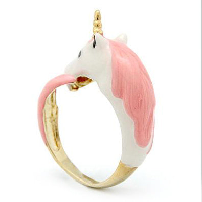 A fantasy-inspired unicorn ring featuring a pink and white design with a golden band.