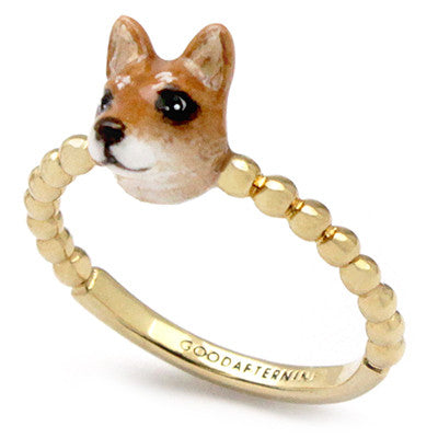 Gold ring featuring a cute dog head design