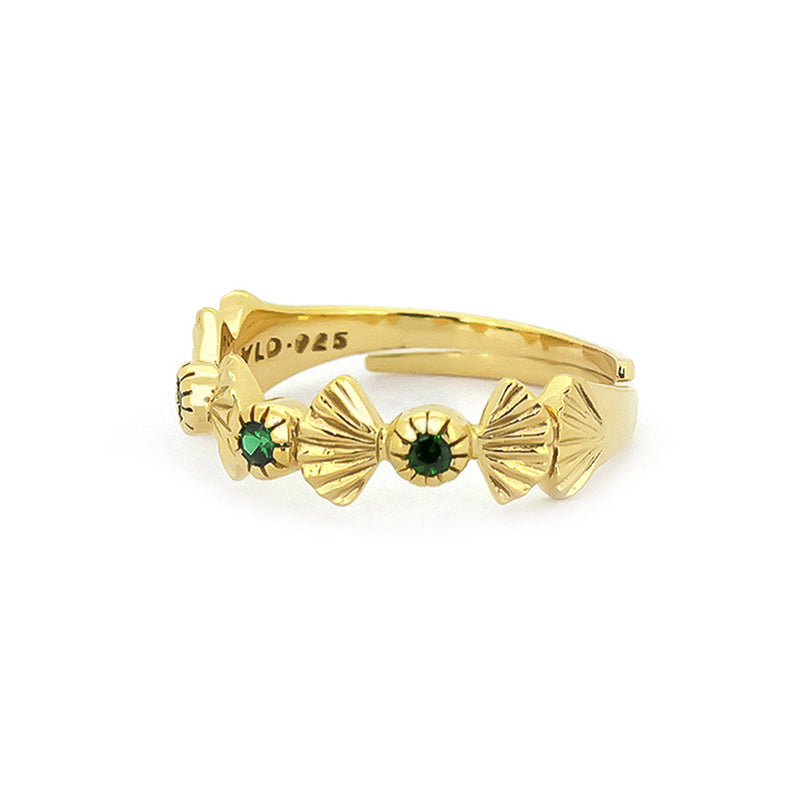 Unique gold ring featuring intricate details and green stones.