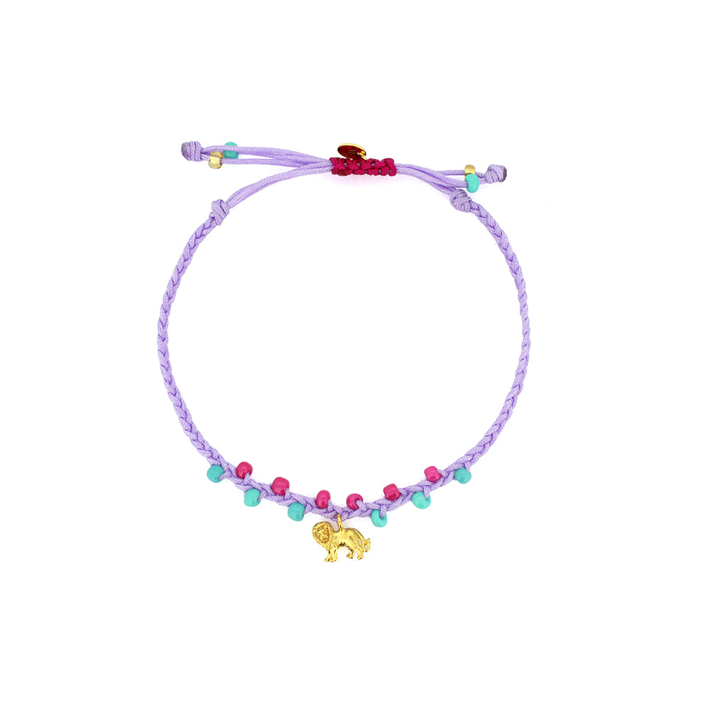 A bracelet in purple and  pink, and turquoise sand beads, featuring  a gold lion charm.