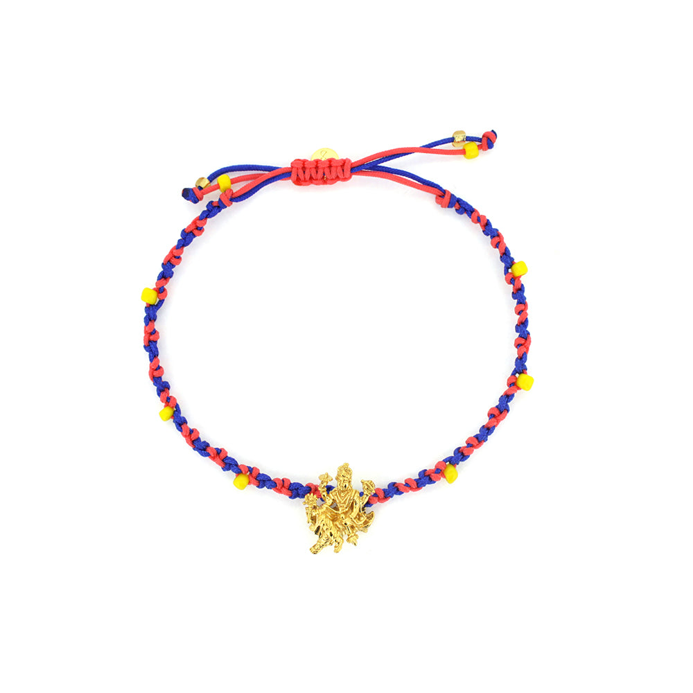 A bracelet in blue and red threads with colorful beads, featuring a gold Trimurti Vishnu charm