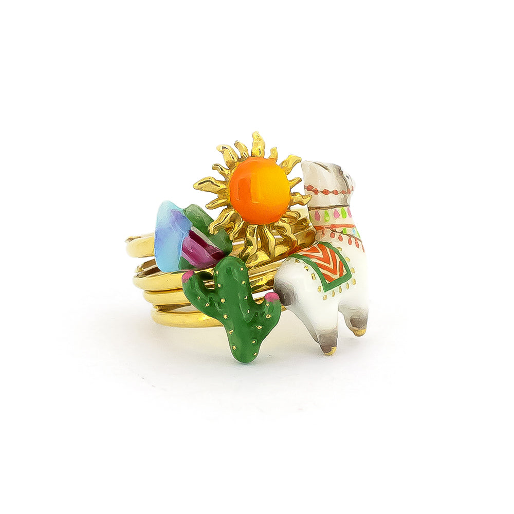 Stacking ring featuring a playful design with an alpaca, a cactus, the sun, and a mountain.