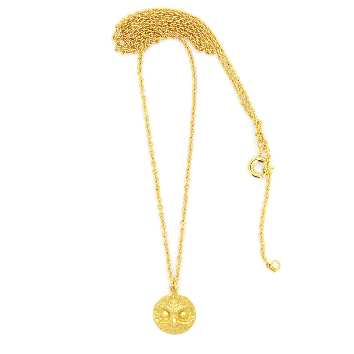 Handmade gold necklace with an intricately designed owl charm